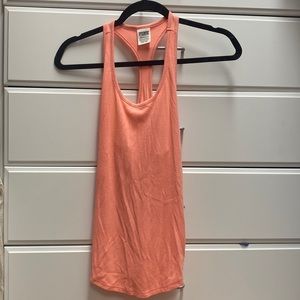 Peach color racer back tank.